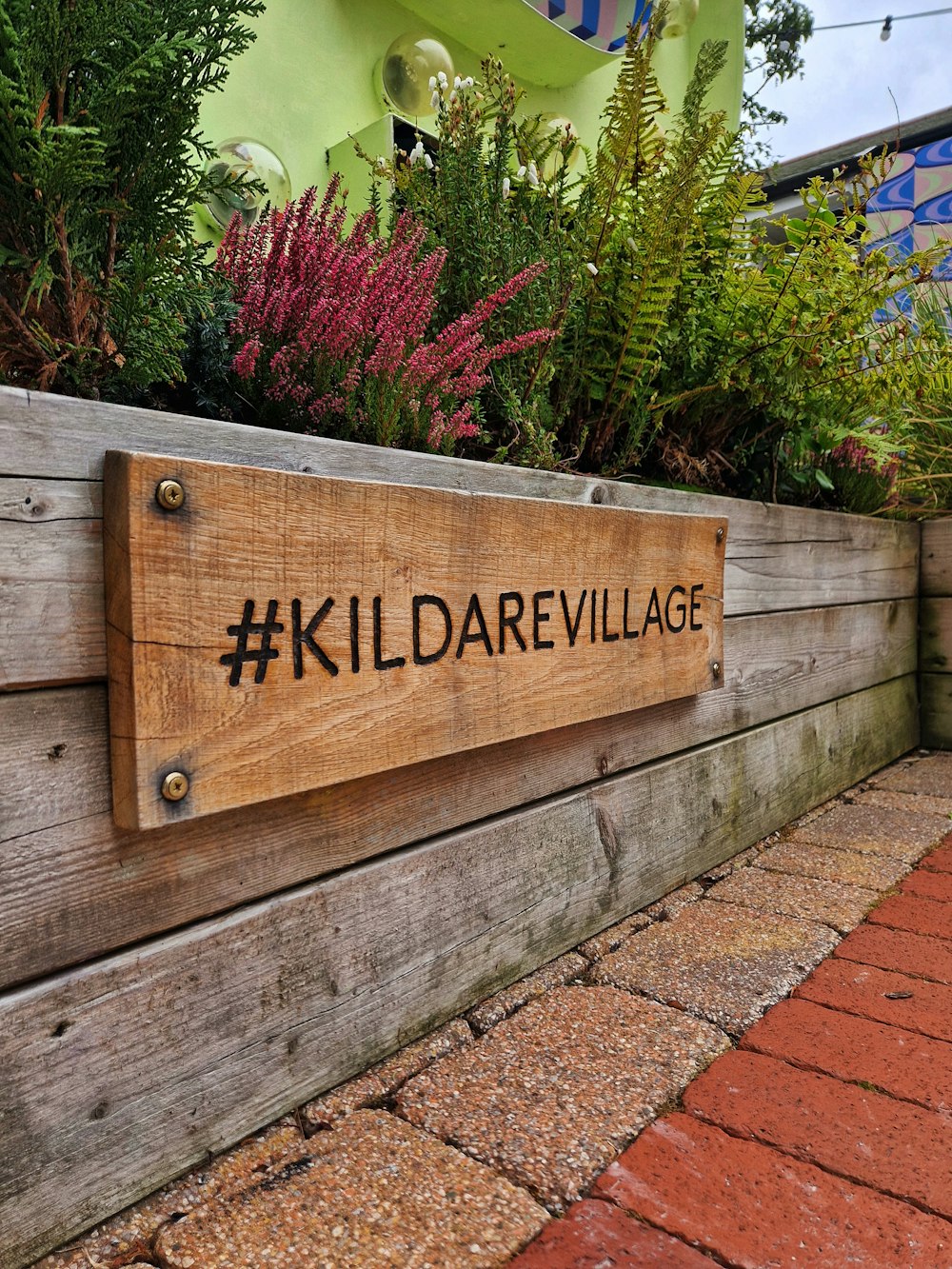 a sign on a wooden fence