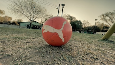 a large red ball in a field