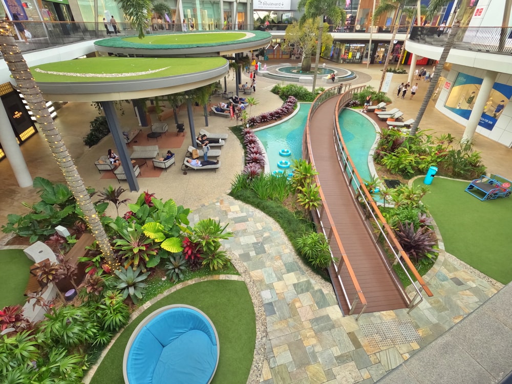 a courtyard with a pool and chairs