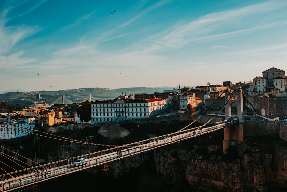 a bridge over a river with buildings on either side of it