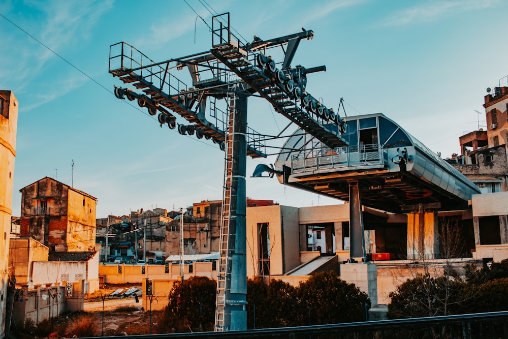 a large metal structure in front of a building