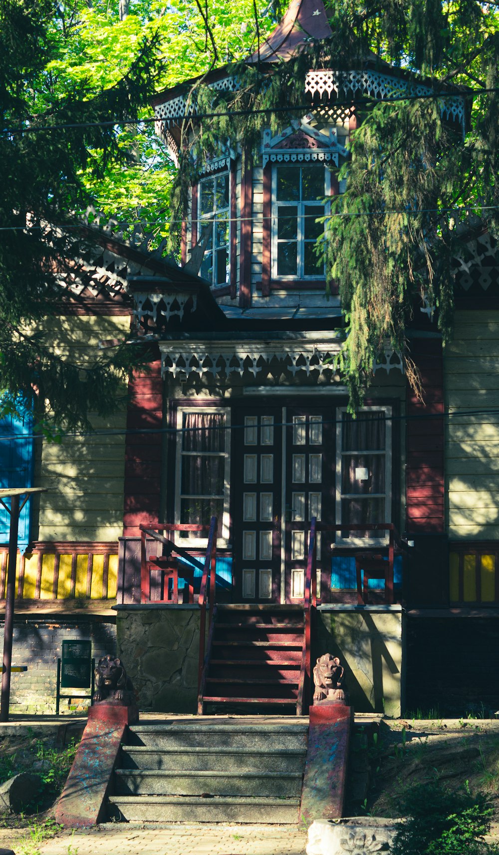 a house with a staircase and trees