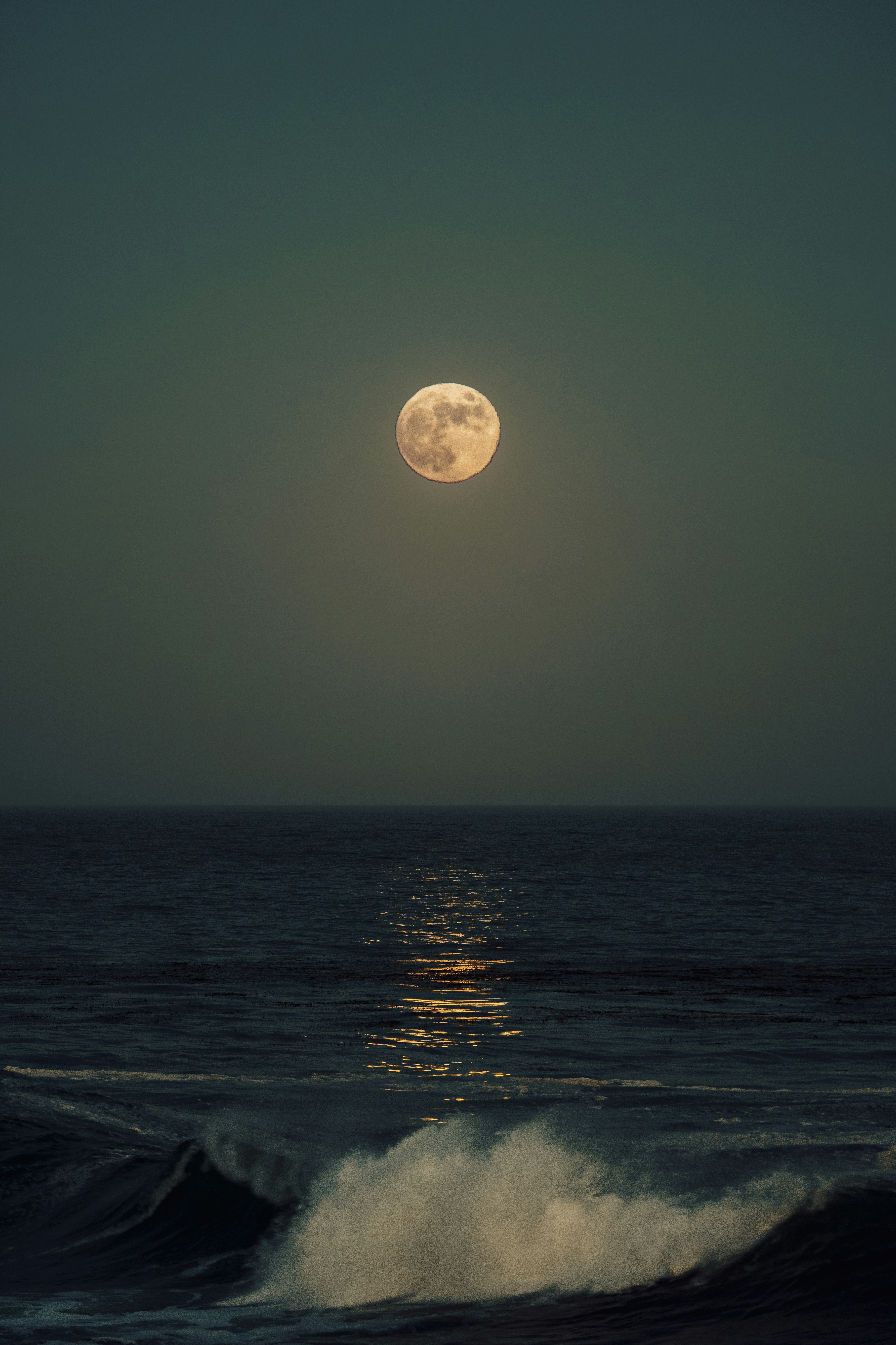 the moon over the ocean