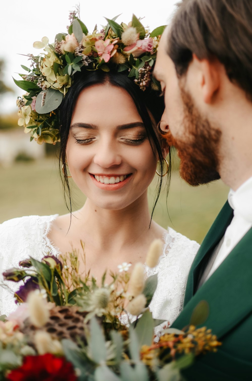 a man and woman holding flowers