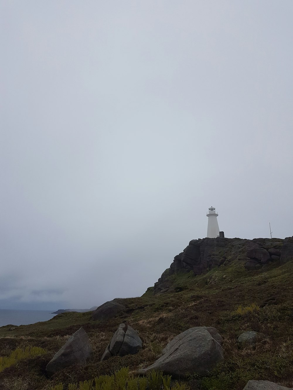 a lighthouse on a hill