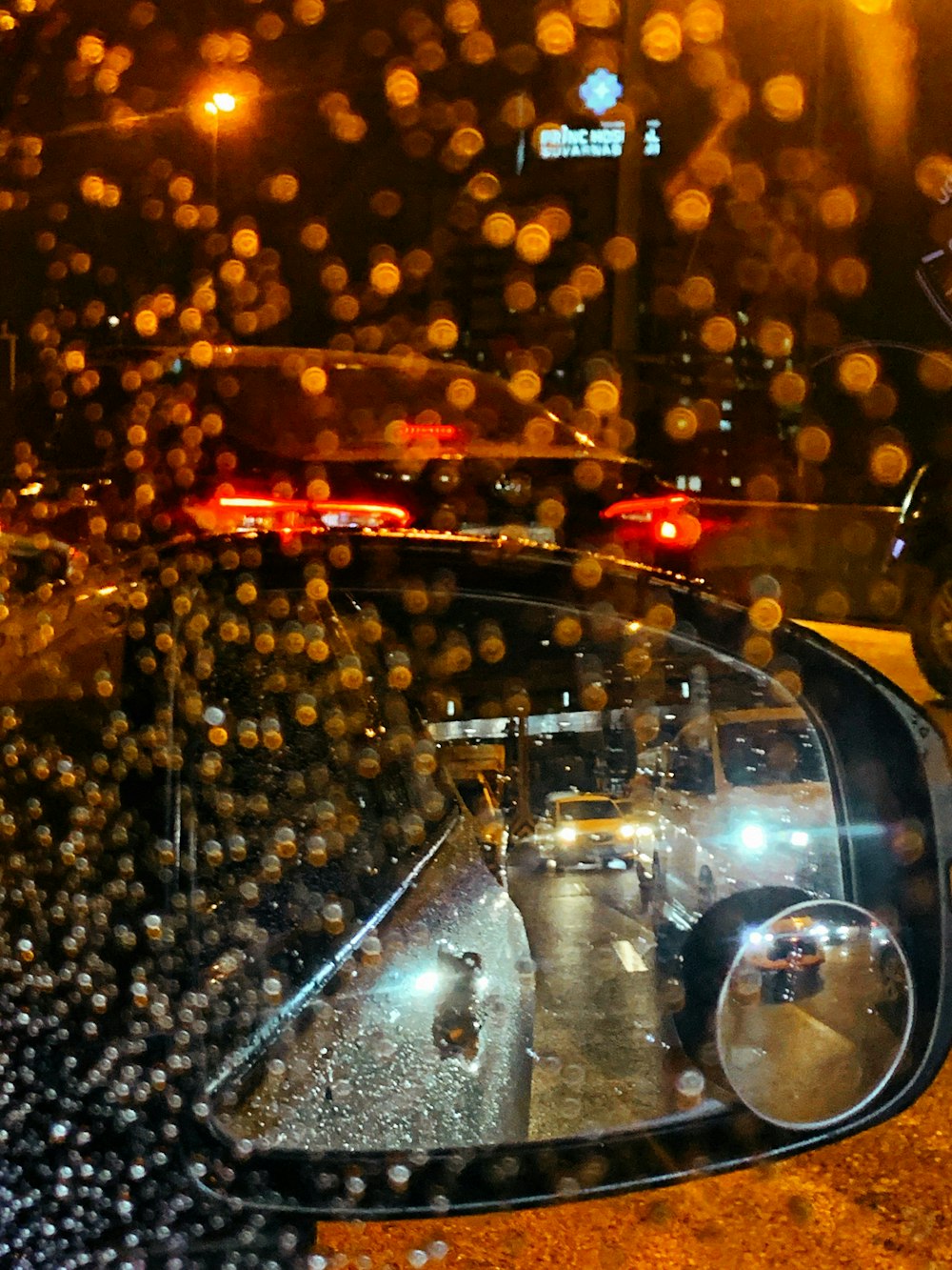 a view of a street through a car windshield