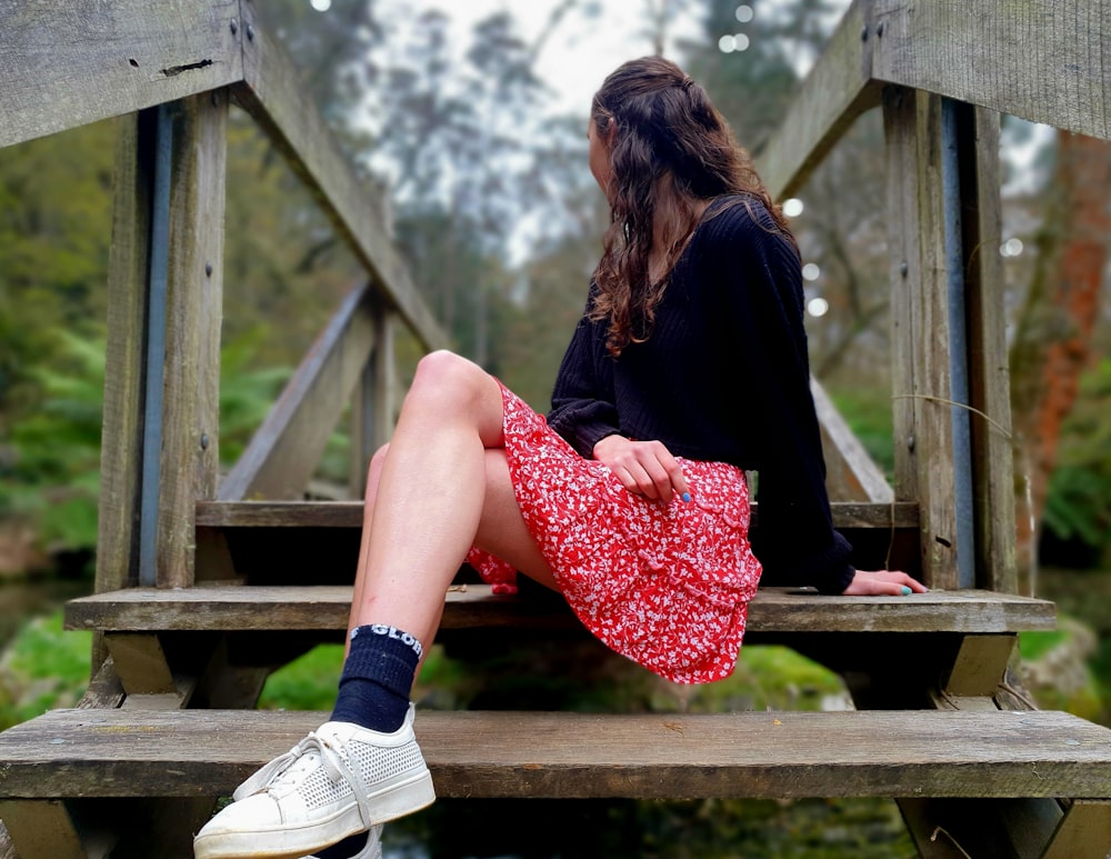 a woman sitting on a bench