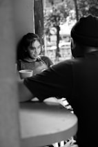 a man and woman sitting outside
