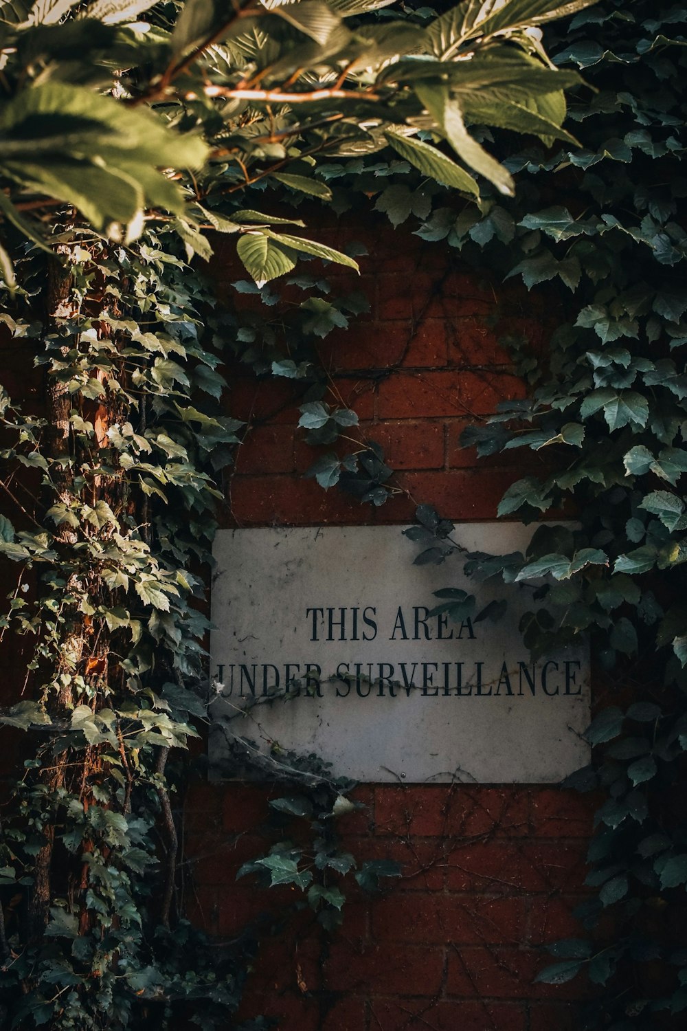 a sign on a brick wall