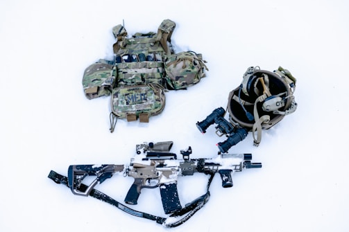 Close-up of tactical gear laid out before a mission briefing.