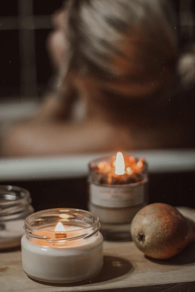 a candle in a glass jar