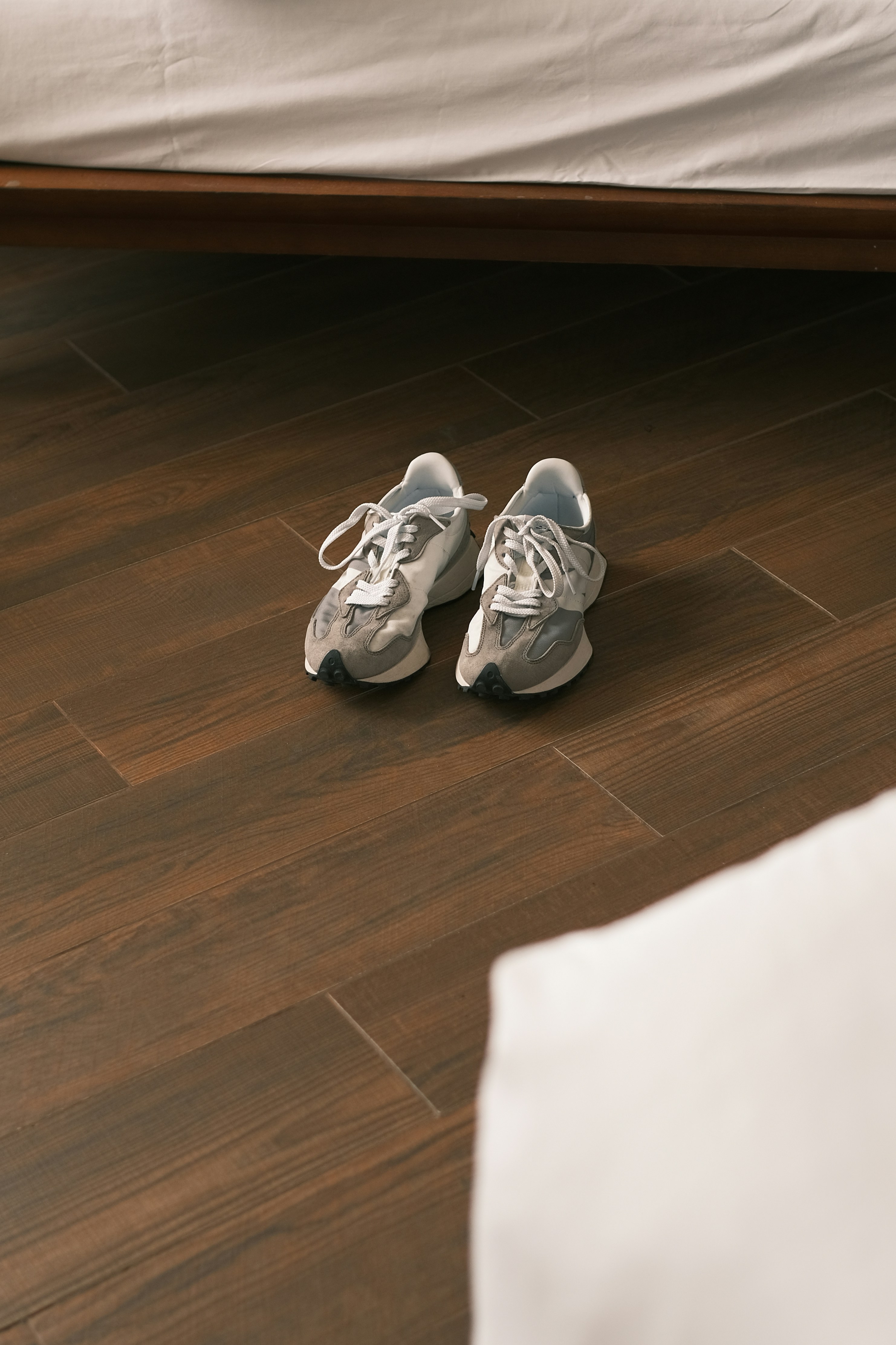 a pair of shoes on a wood floor