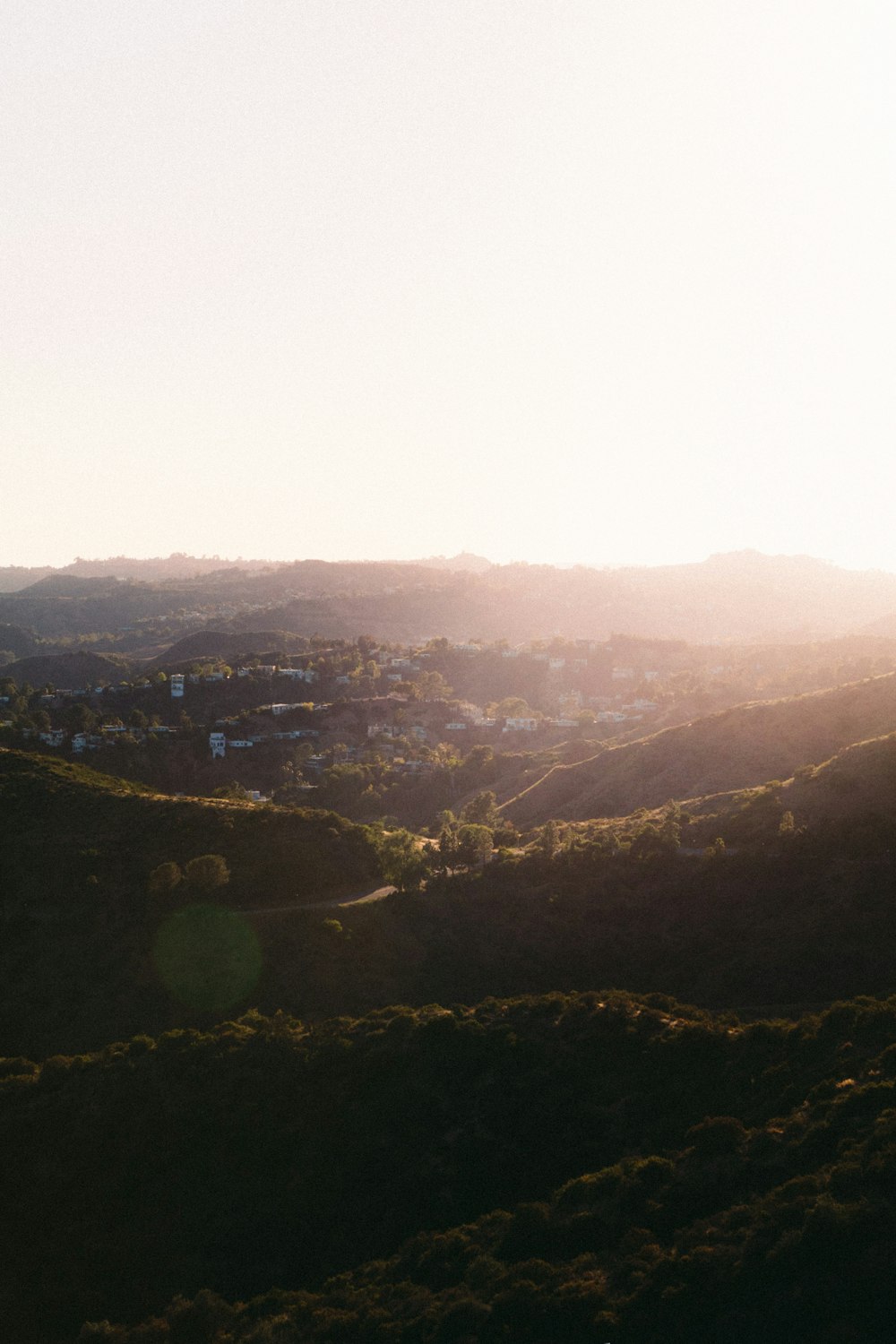 a landscape with a town in the distance