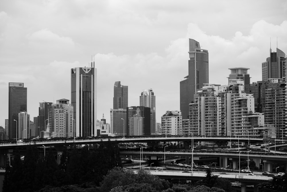 a city skyline with a bridge