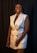 A happy customer wearing a stylish dress from Herlook.