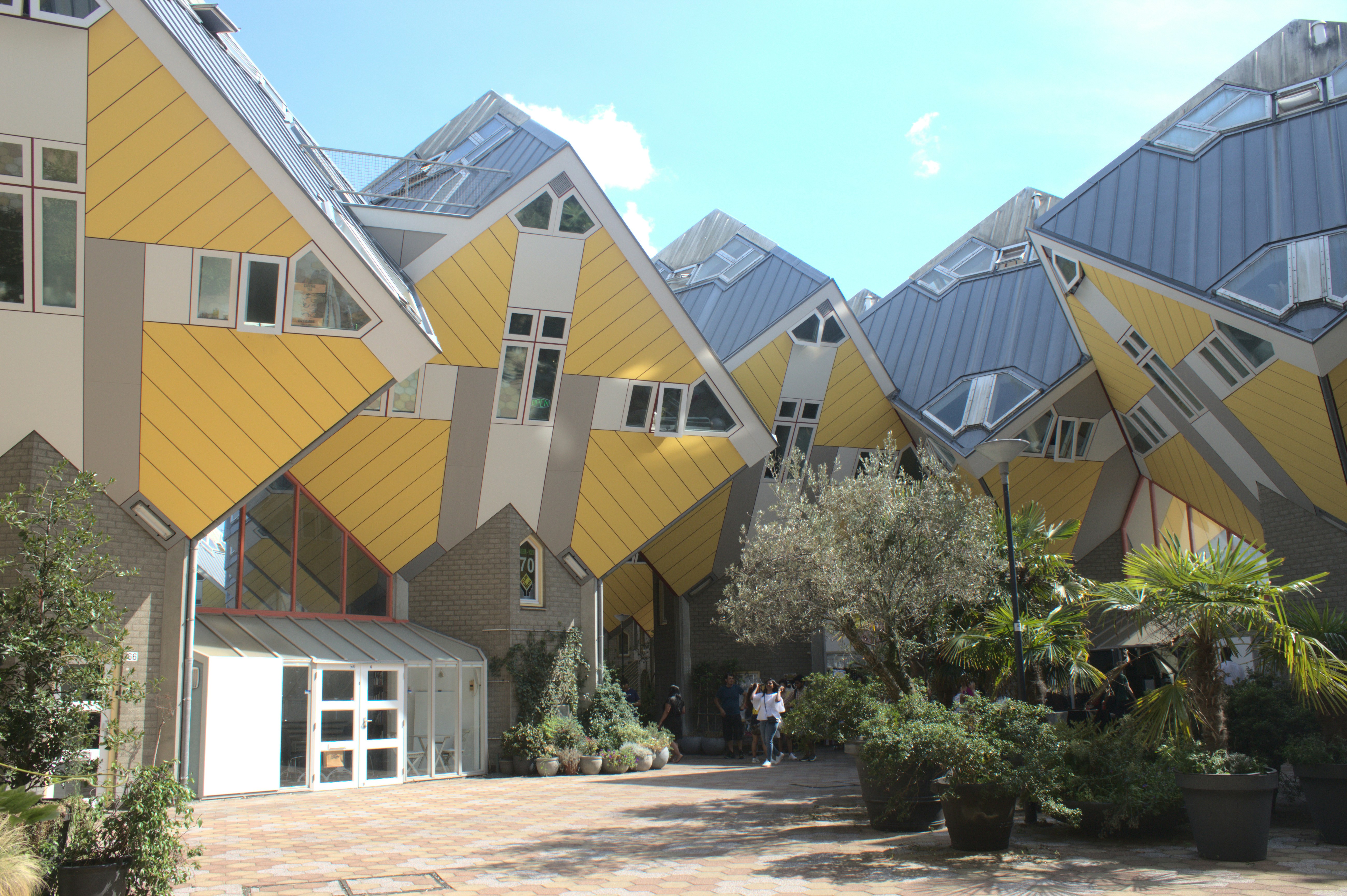 a building with a few people walking by it