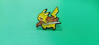 Close-up of a Lightlines enamel pin shaped like a lightning bolt.