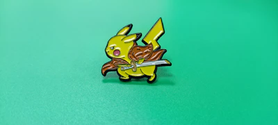 Close-up of a Lightlines enamel pin shaped like a lightning bolt.