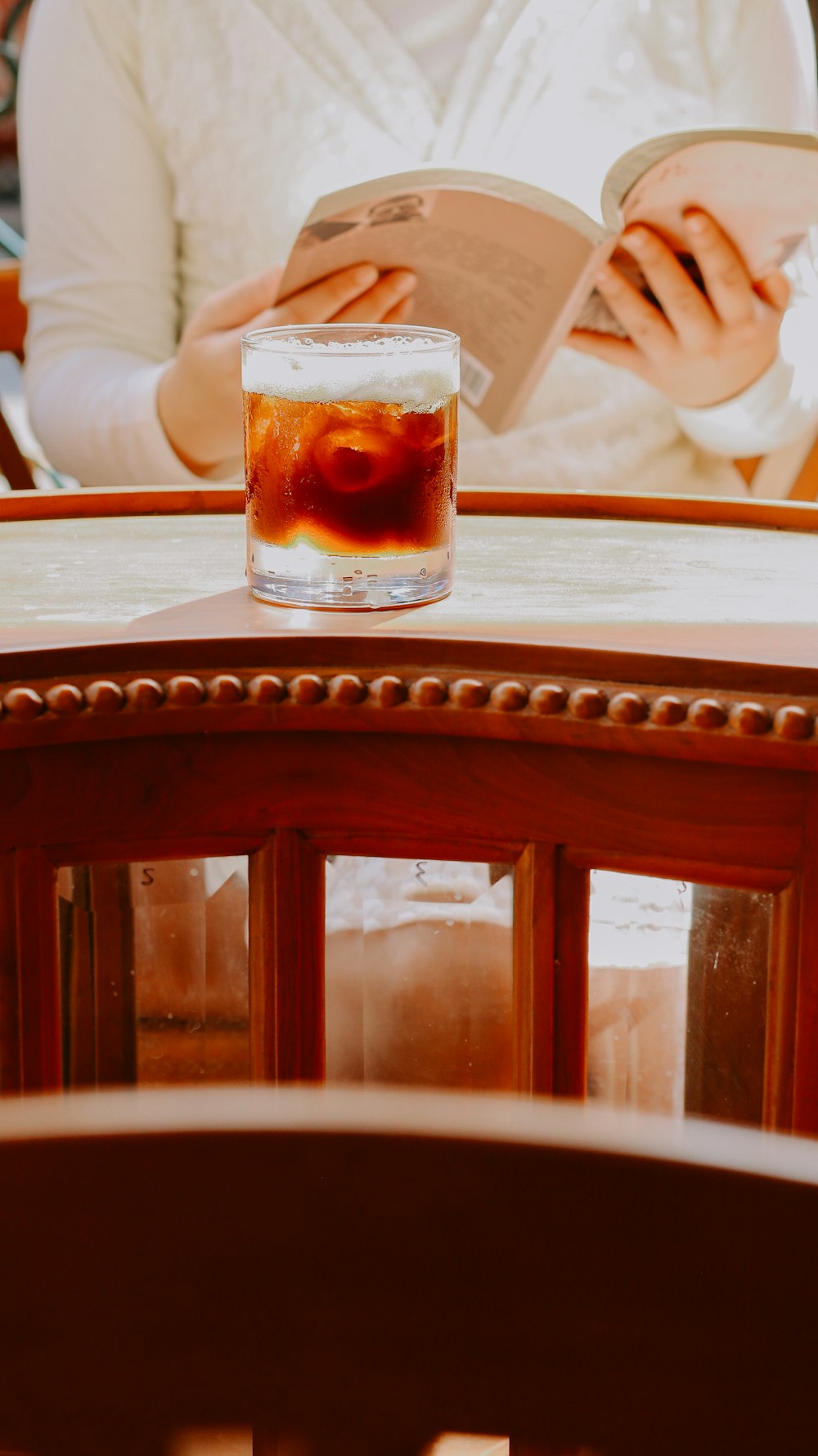 a glass of liquid on a table