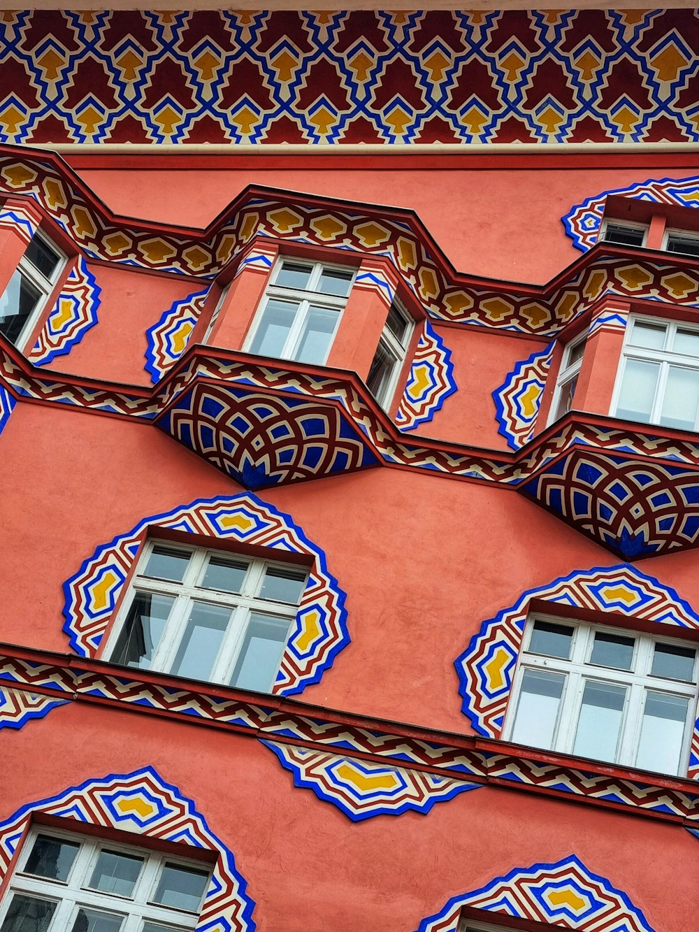 a building with a red and blue design