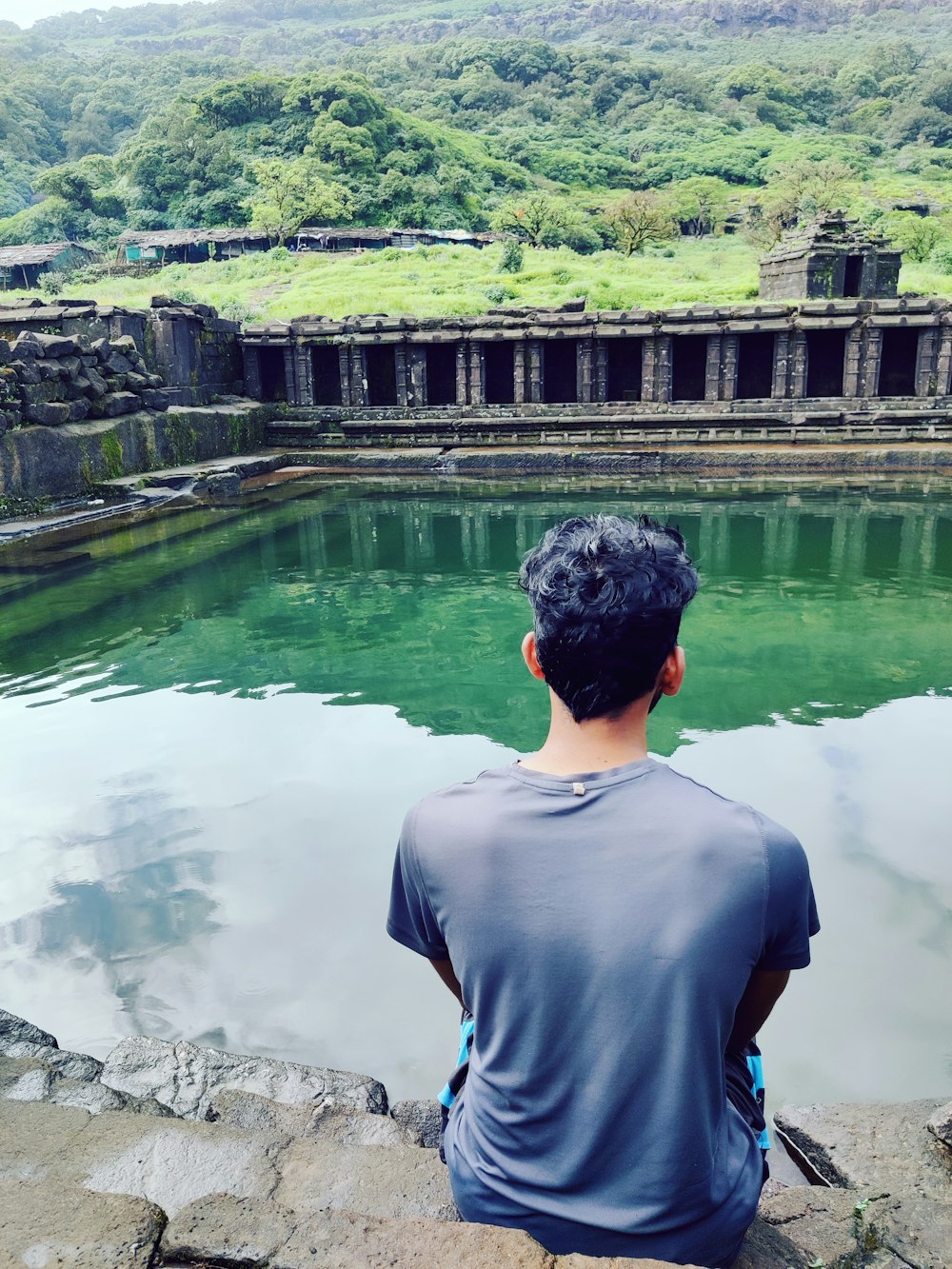 a man looking at a body of water