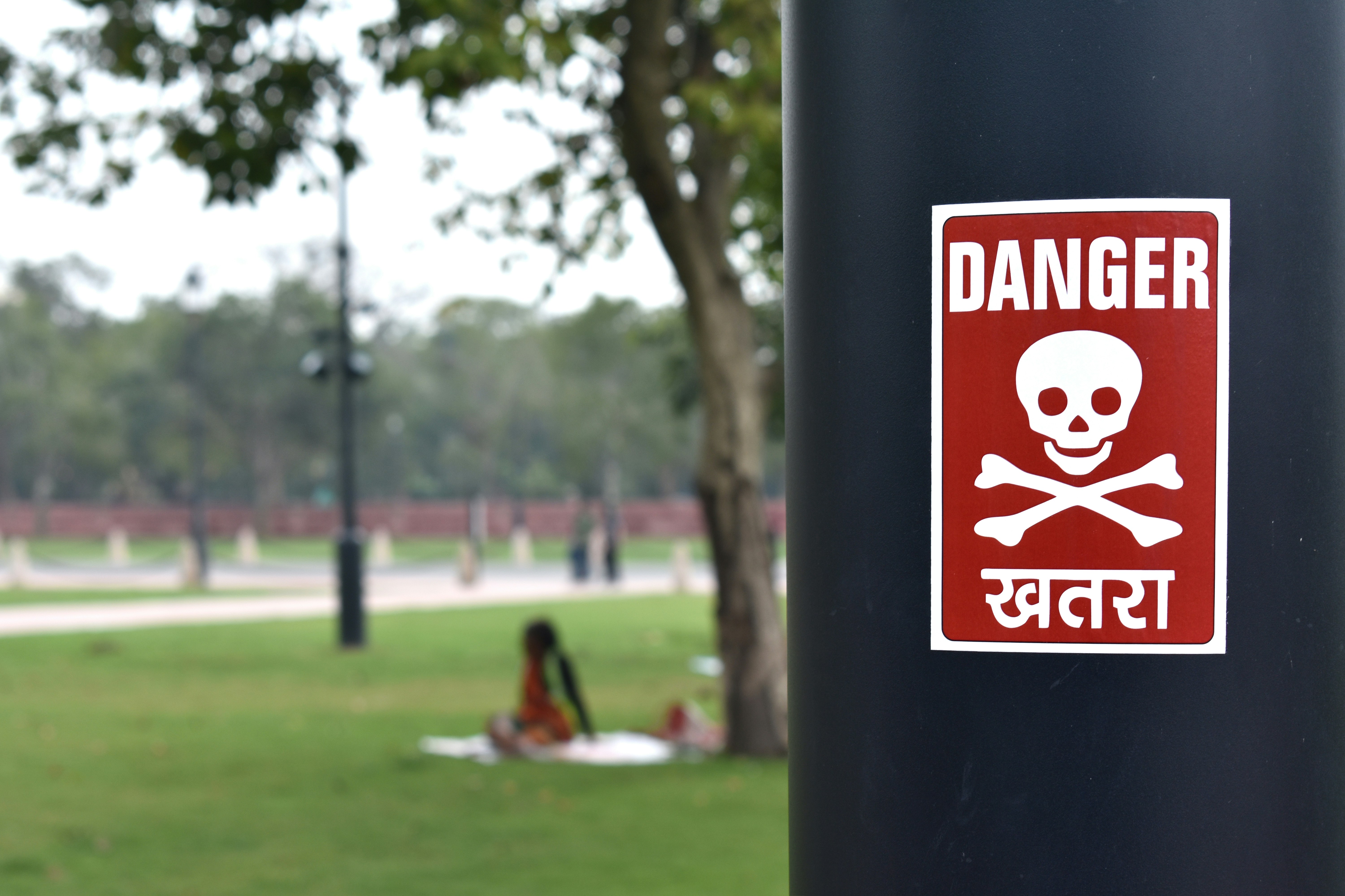 Danger sign on a light pole, Central Vista, Kartvya Path, India Gate, New Delhi, India [Photo: September 2022]