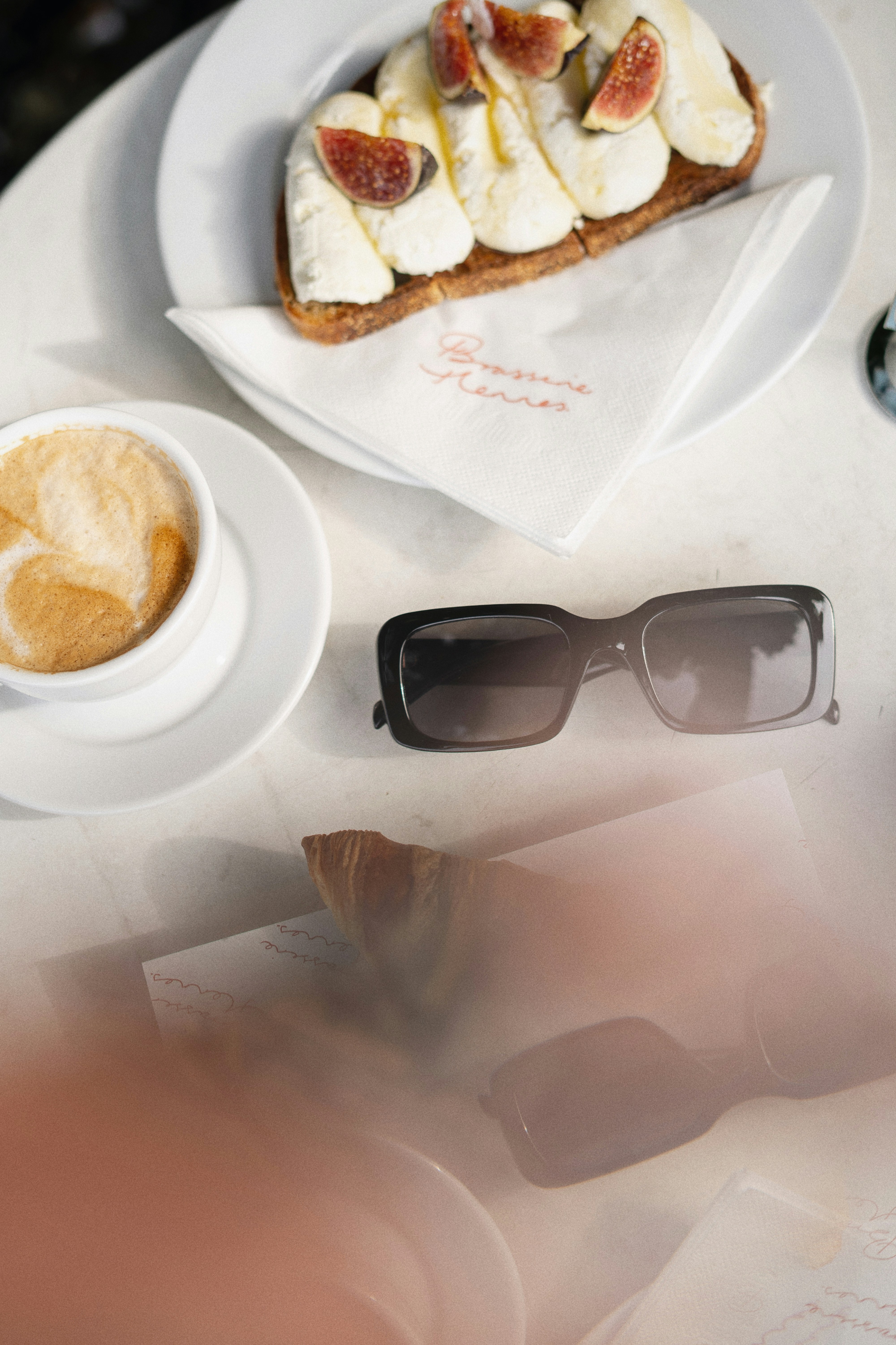 A delicious cappuccino and croissant for breakfast.
