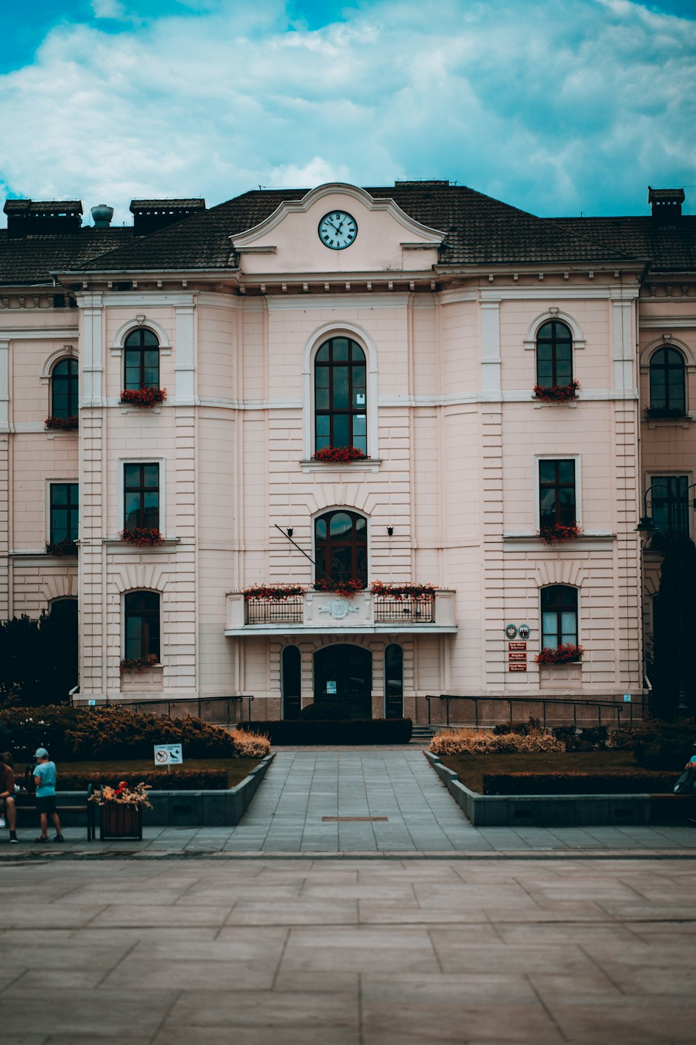 a large white building with a clock on it