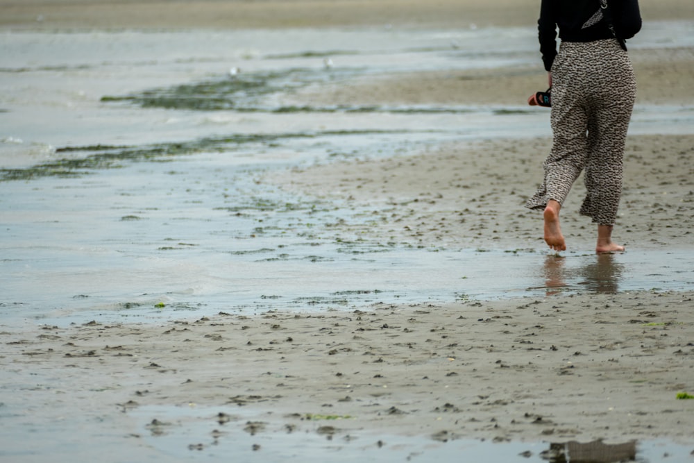 a person walking on a beach