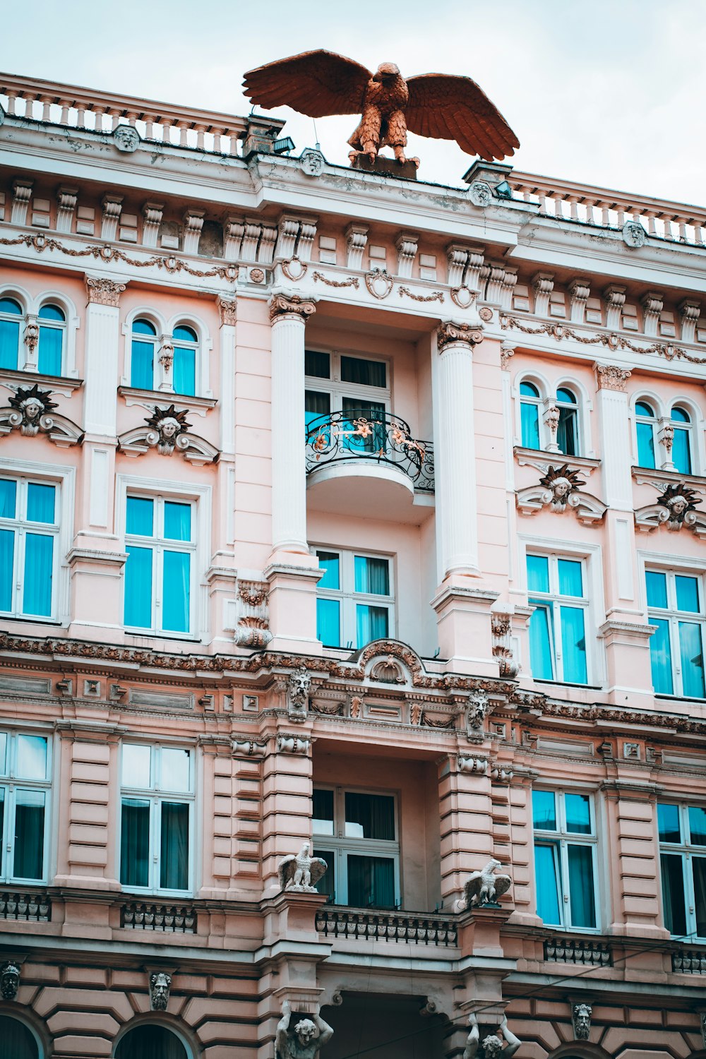 a building with a statue on the roof