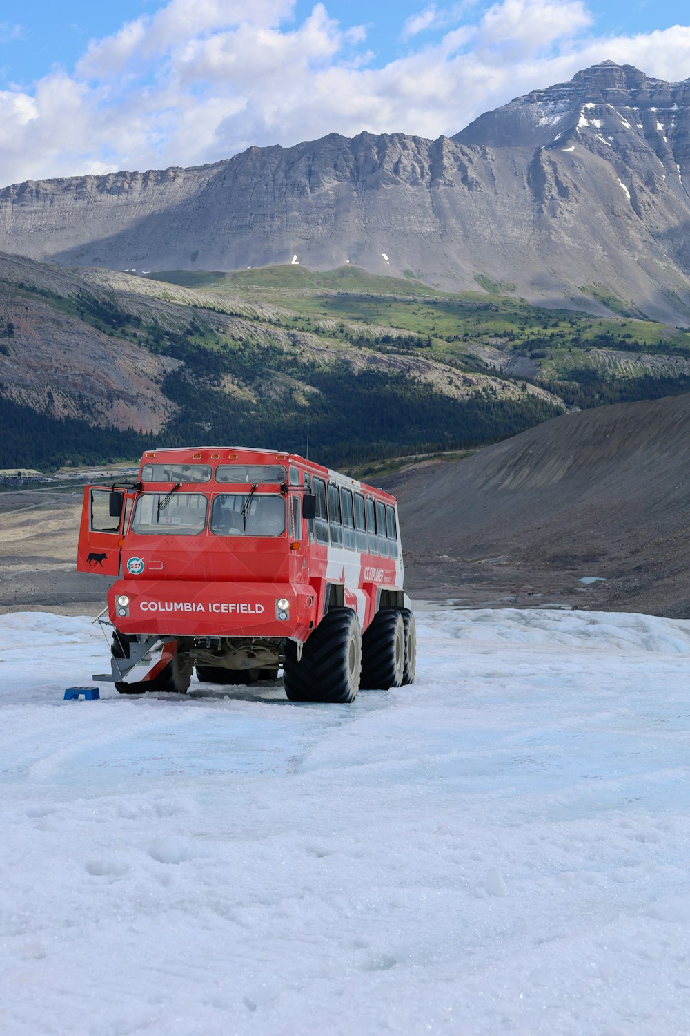 a red truck on a snowy road