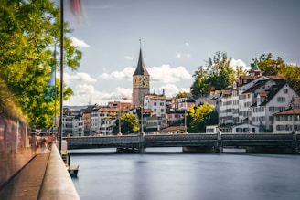 a bridge over a river with buildings on either side of it