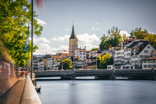 a bridge over a river with buildings on either side of it