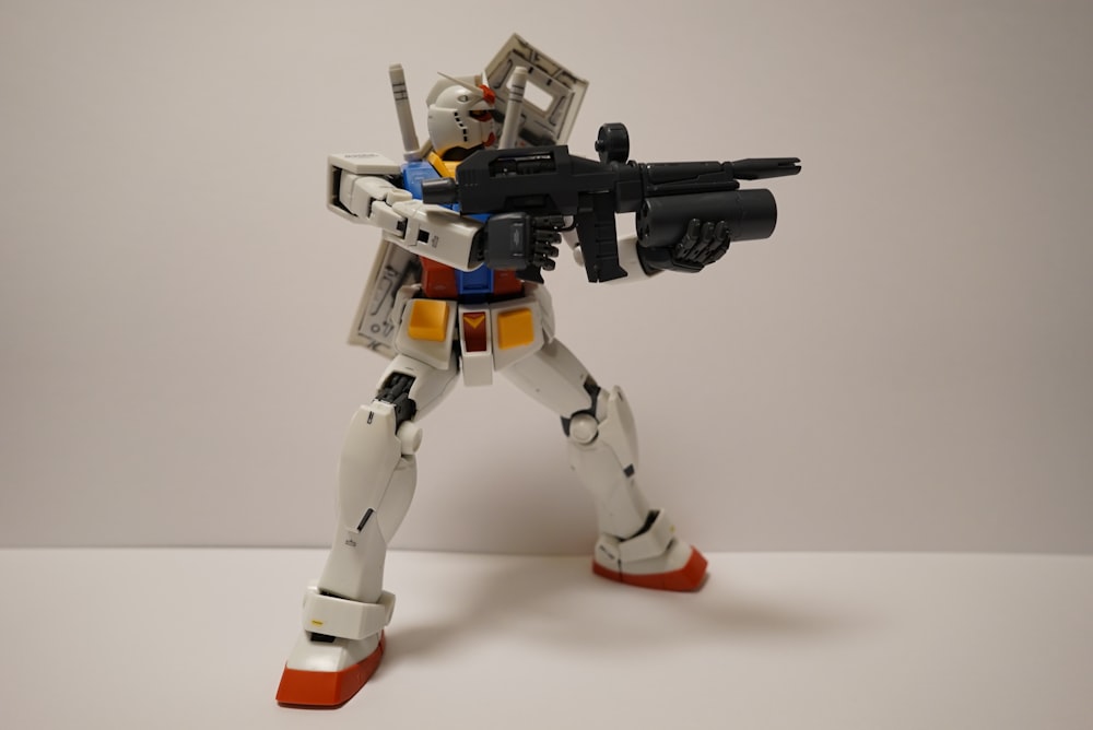 a toy robot with a gun