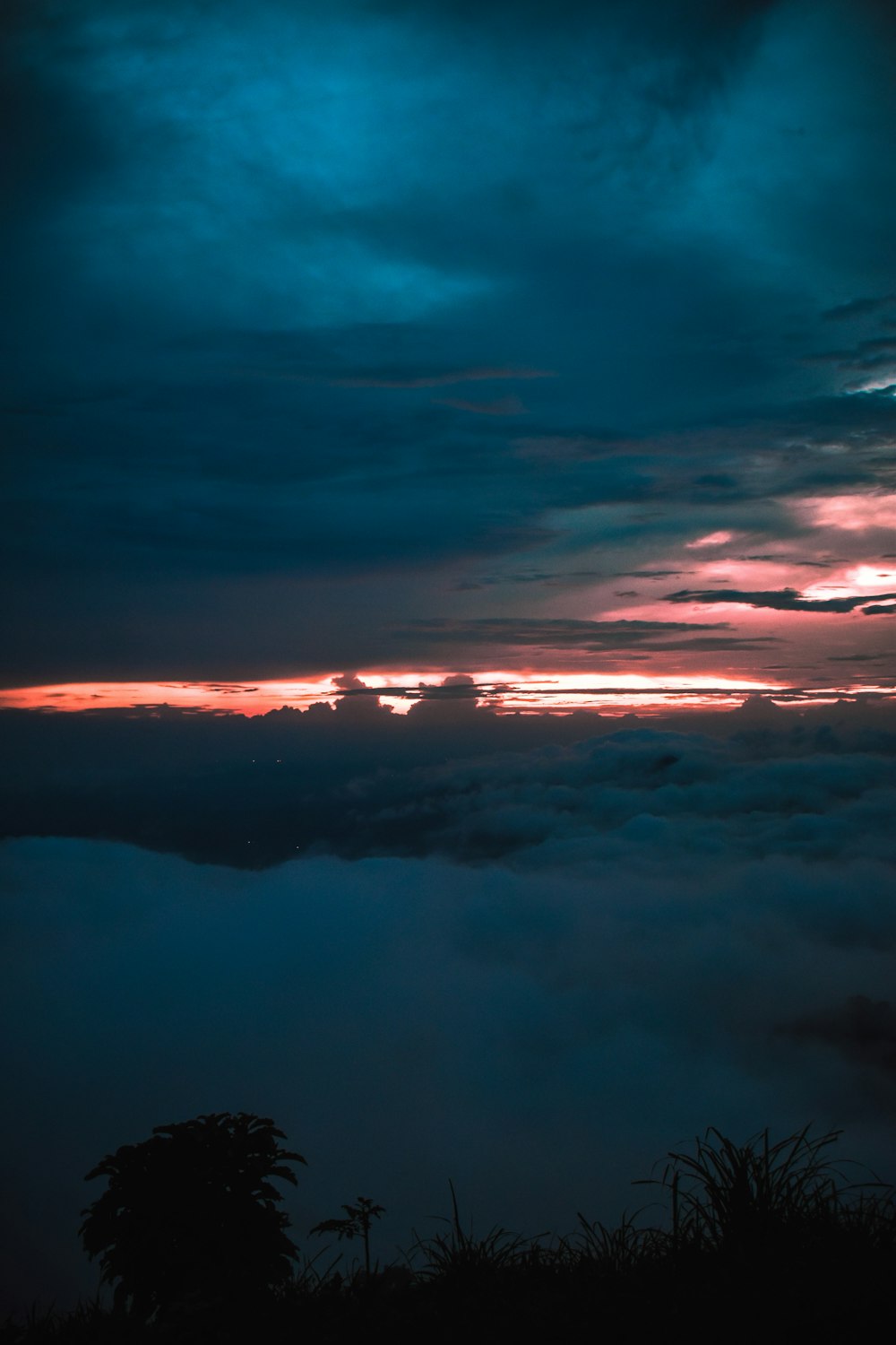 a sunset over a mountain