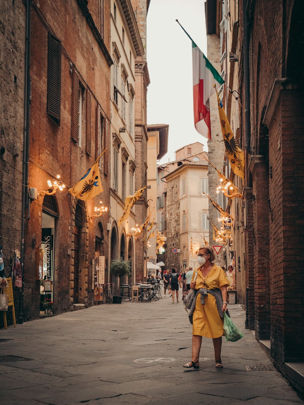 a woman walking down a street