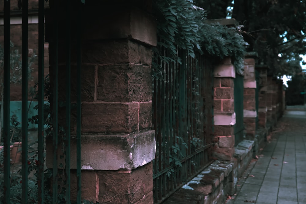 a brick wall with a gate