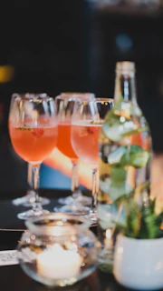 a group of glasses with liquid in them