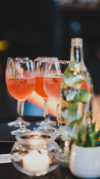 a group of glasses with liquid in them