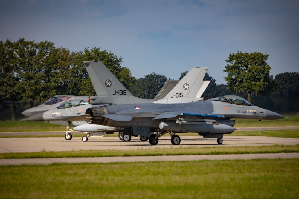 a couple of jets on a runway