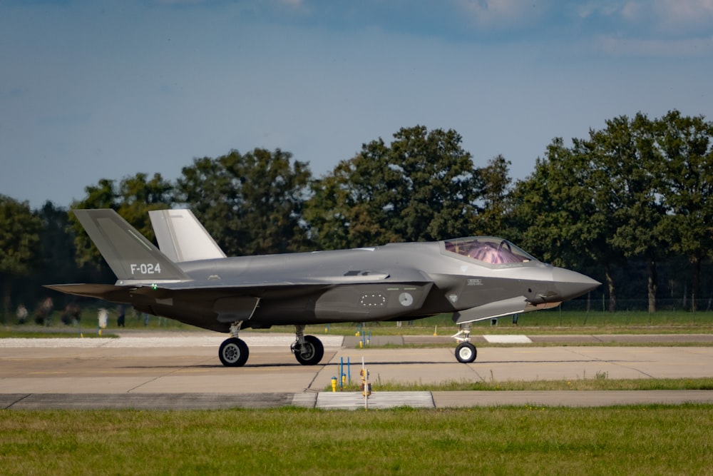 a fighter jet on the runway