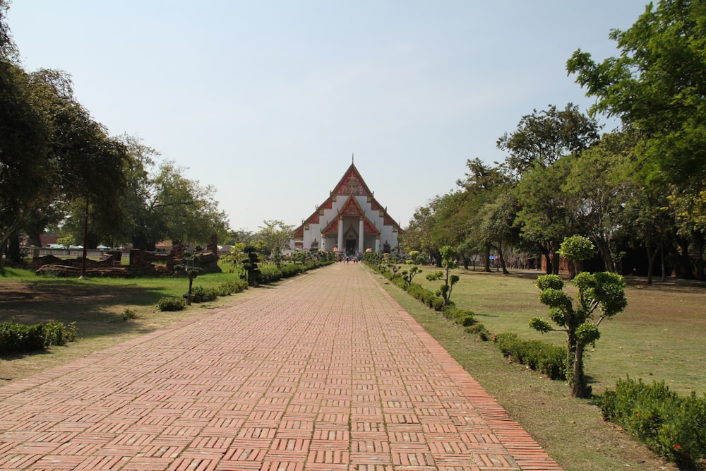 a brick pathway leading to a building