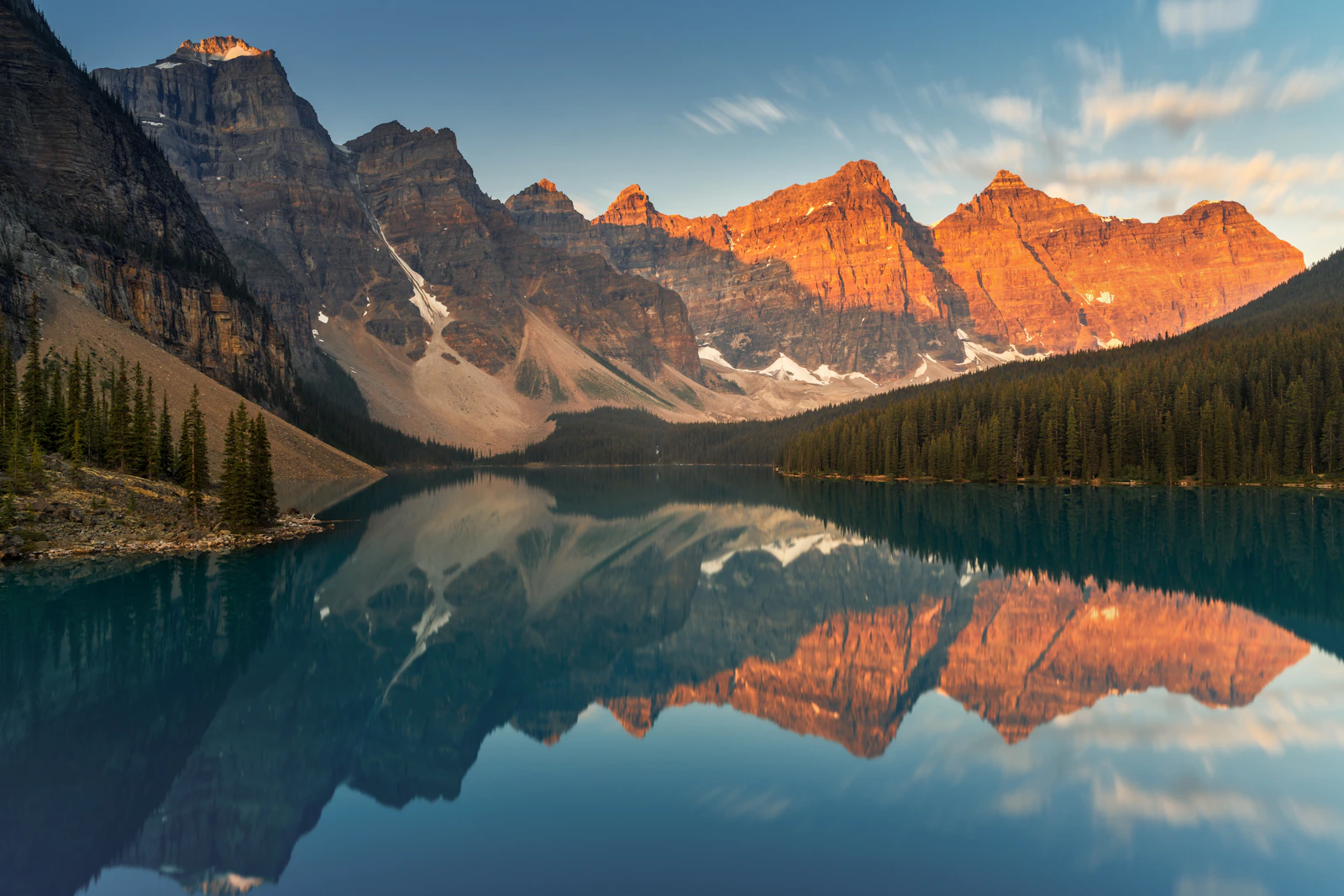 Moraine Lake and the Canadian Rockies reflected in clear blue water