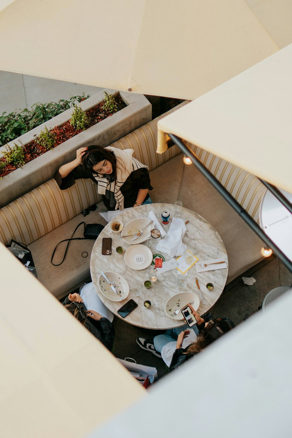 a person sitting at a table with a plate of food