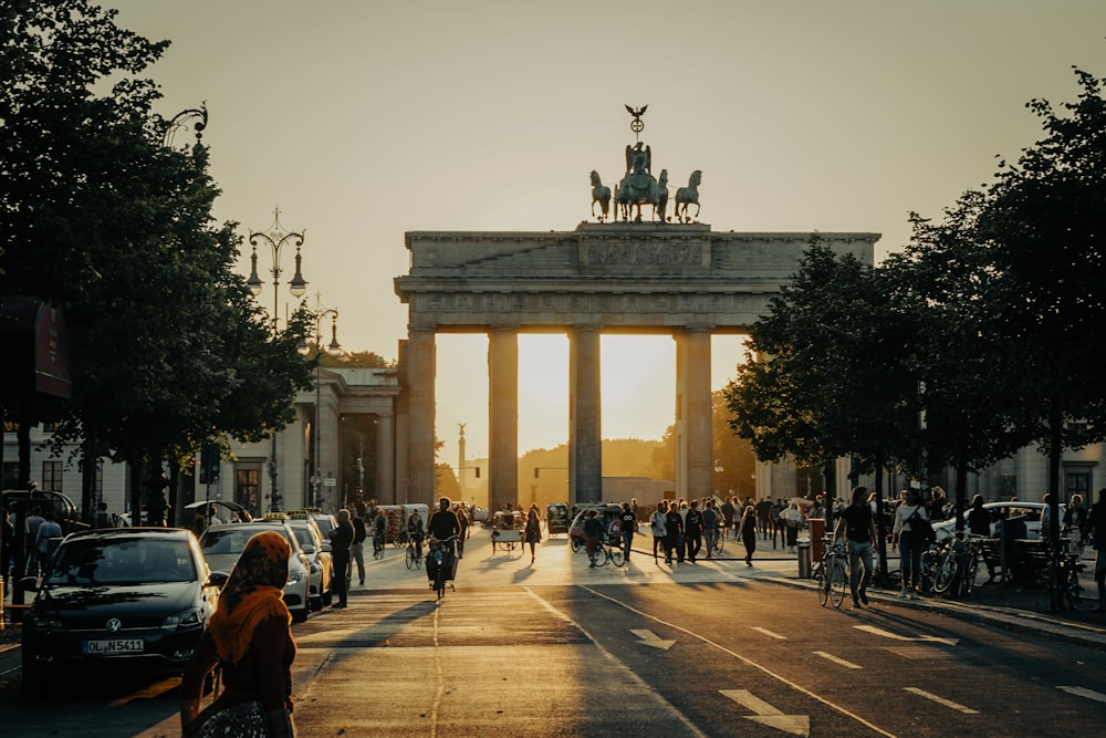 a large arch with a statue on top of it