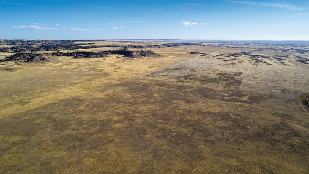 a large flat area with a few rocks in it