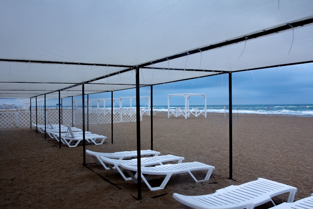 a beach with a gazebo, awful weather