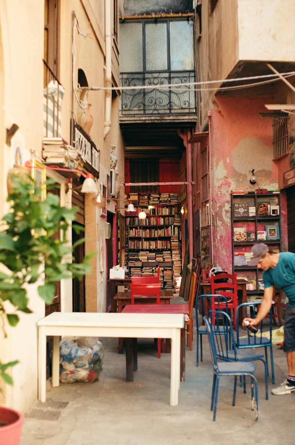 a person sitting at a table outside a building