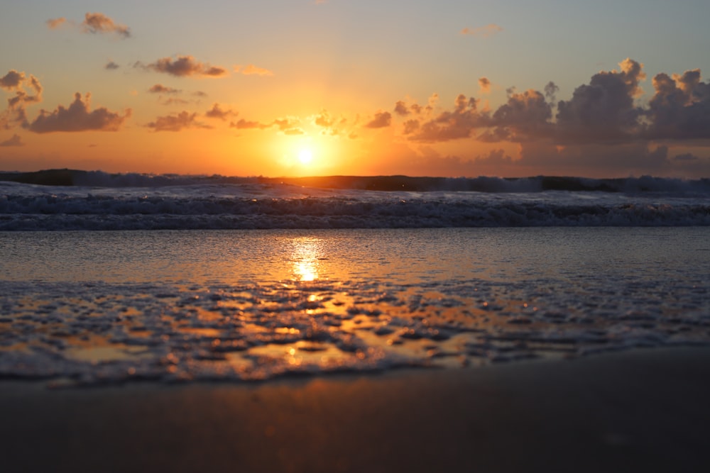 a sunset over a beach