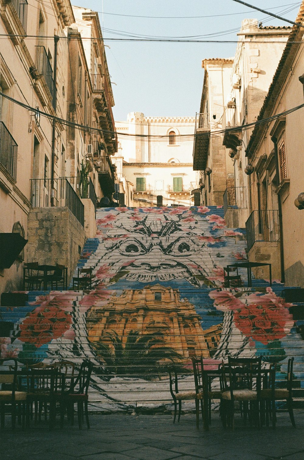 a street with tables and chairs